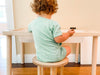 RAD Grow Stool Toddler Sitting on Grow Stool