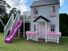 Whole Wood Playhouse two story playhouse with slide pricess front