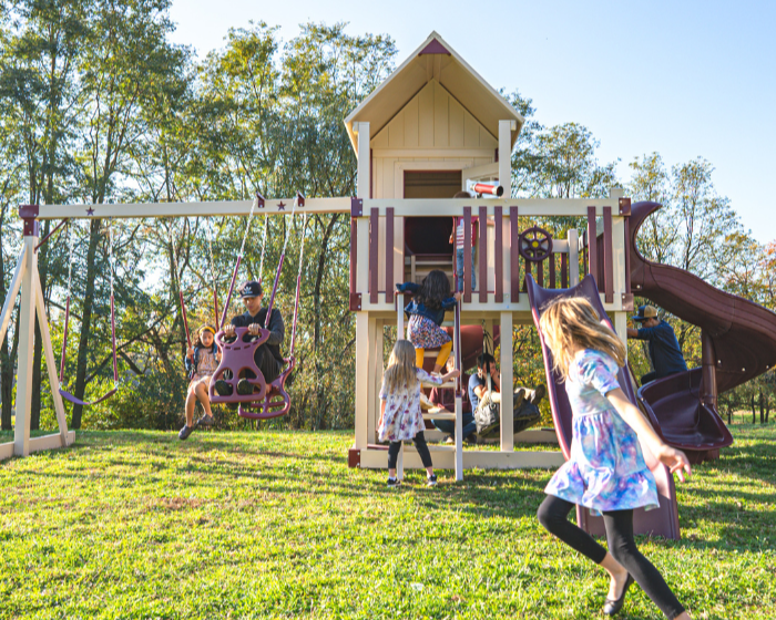 Orion’s Hideout Vinyl Swing Set with Playhouse and 3 slides