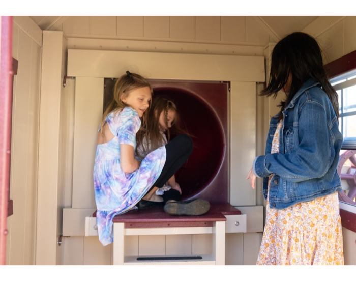 Orion’s Hideout Vinyl Swing Set with Playhouse slide entrance