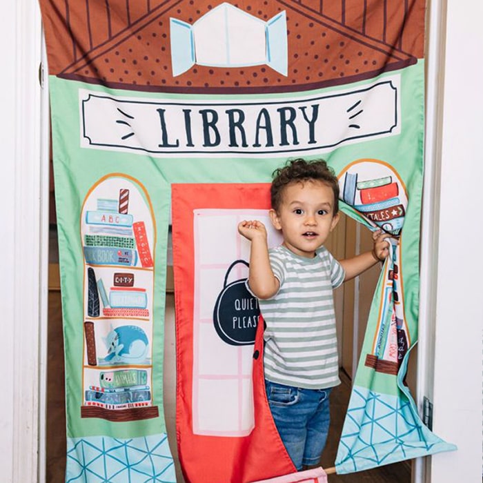 Wonder & Wise Reversible Coffee Shop and Library Doorway Playhouse Kid On Library Door